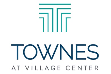 A logo with the words "Townes at Village Center" in blue.