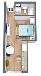 A top-down view of a small apartment with a bedroom, living room, and bathroom at The Teale Golden Gate in Naples, FL, 34116