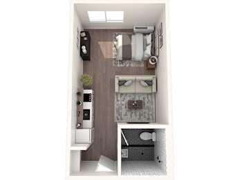 A small room with a bed, a desk, and a chair.