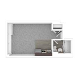 A white room with a bed and a desk.