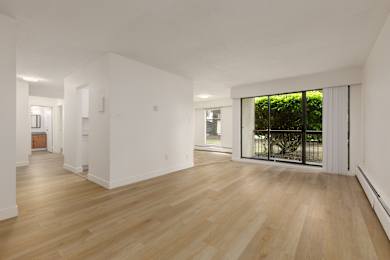 A room with wooden floors and white walls.