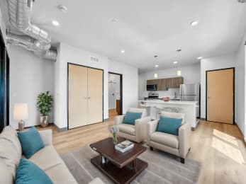 a living room with couches and a coffee table