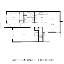 A black and white drawing of a house's first floor plan.