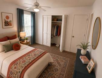 Floor Plan  A bedroom with a large bed and a ceiling fan.