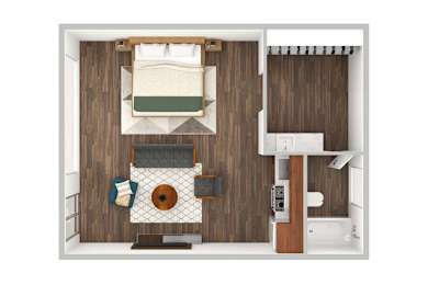 A small room with a bed, a table, and a chair.