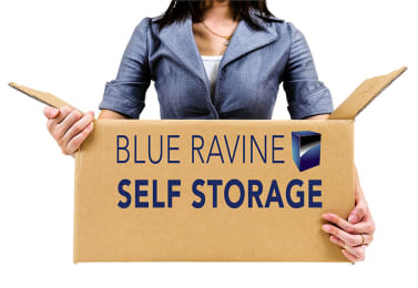Woman with Storage Boxes at BLUE RAVINE SELF STORAGE, California
