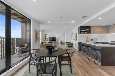 a living room with a table and chairs
