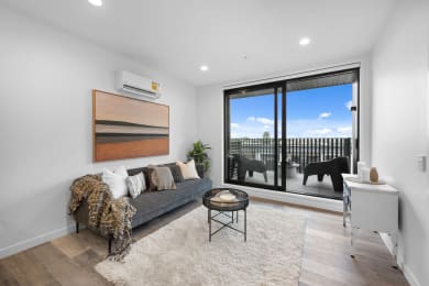 a living room with a couch and a large window