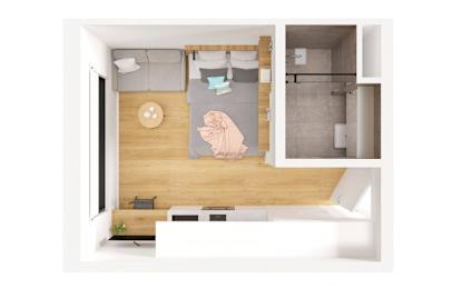 a bedroom with a bed and a desk and a living room