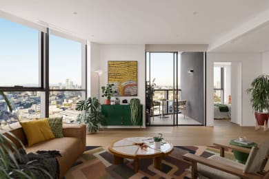 a living room with a couch and a table and some windows