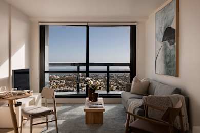 A living room with a view of the city.
