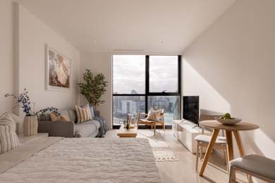 A modern living room with a large window overlooking a cityscape.
