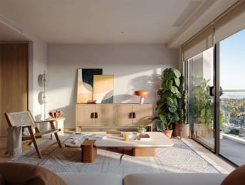 a living room with a view of the bay from a balcony