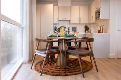 Floor Plan  A modern dining room with a table set for four.