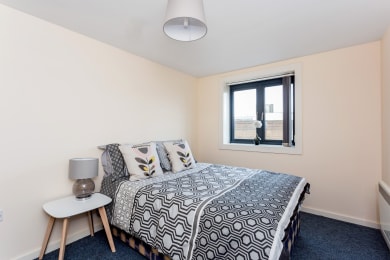 Floor Plan  a bedroom with a bed and a window