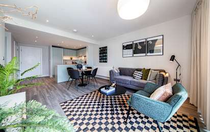 A living room with a black and white checkered floor.