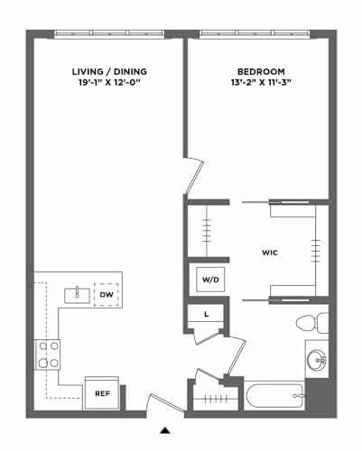 Floor Plan  A floor plan of a small apartment with a living/dining area, bedroom, and a WC.