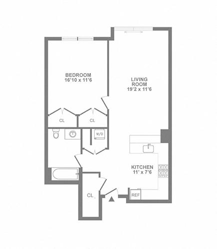 Floor Plan  A floor plan of a small apartment with a bedroom, living room, and kitchen.