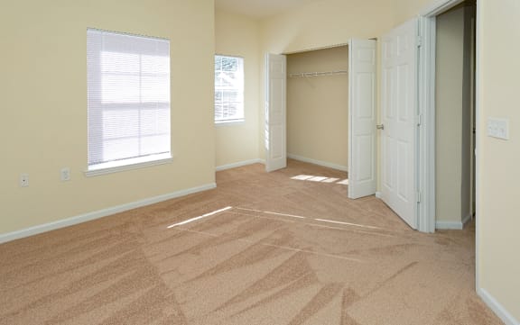 Floor Plan  A room with a carpeted floor and two open doors.