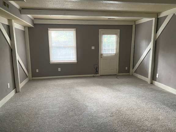 Floor Plan  an empty room with a door and two windows