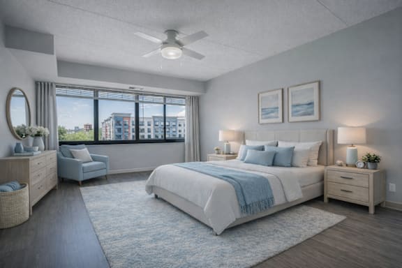 Floor Plan  A bedroom with a large bed and a view of the city.