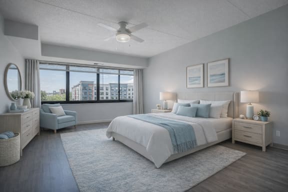 Floor Plan  A well-lit bedroom with a large bed and a view of the city.