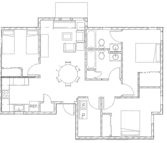 Floor Plan  A floor plan of a house with a central circular room and various rectangular rooms surrounding it.
