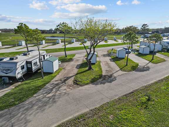 Floor Plan  A sunny day at the RV park with a clear blue sky.