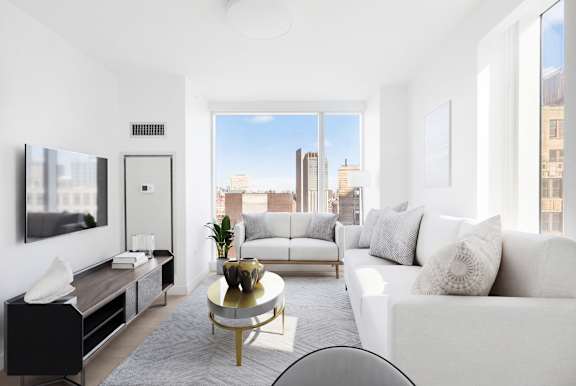 Floor Plan  A modern living room with a view of the city skyline.
