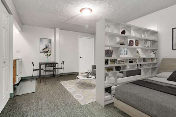 Floor Plan  A bedroom with a bed, a desk, and a bookshelf.