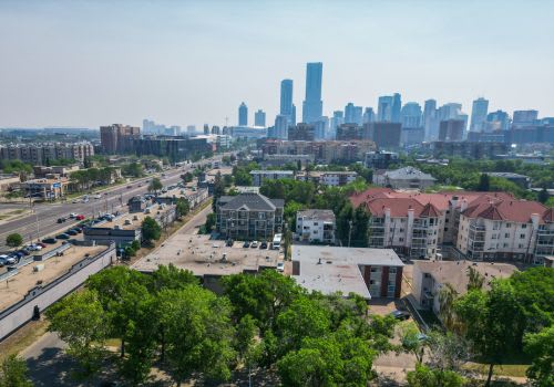 A cityscape with a mix of residential and commercial buildings.