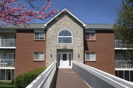Floor Plan  A brick building with a white door and windows.