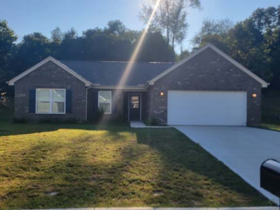 Floor Plan  A house with a garage and a driveway is captured in the image.