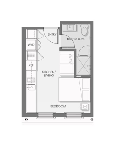 Floor Plan  A floor plan of a small apartment with a bedroom, kitchen, and bathroom.