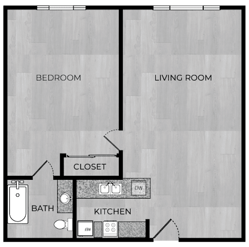 Floor Plan  A floor plan of a small apartment with a bedroom, living room, kitchen, and bathroom.