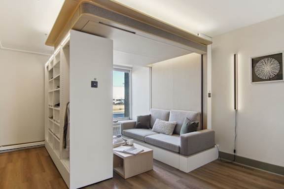 Floor Plan  a living room with a couch and a book shelf