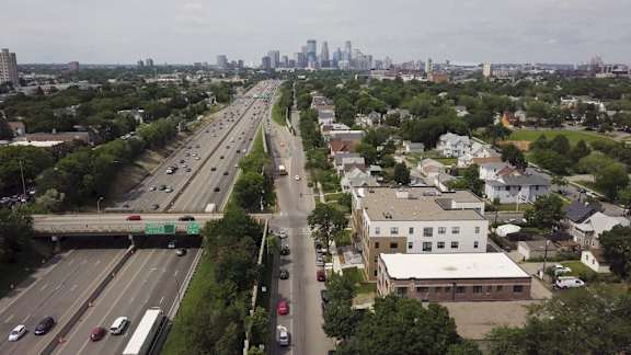 a view of the city from a bridge over a highway