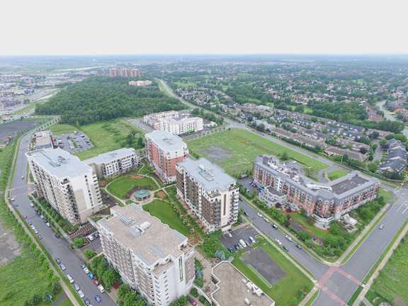 A bird's eye view of a residential area with multiple apartment buildings.