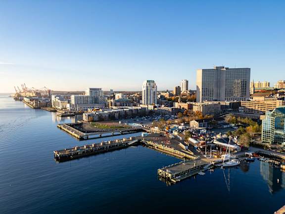 A cityscape with a waterfront and buildings.