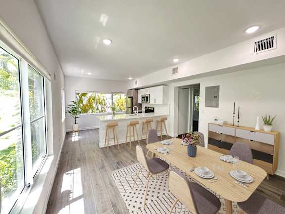 Floor Plan  a dining room and kitchen with a table and chairs