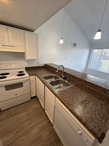 Floor Plan  Kitchen with white cabinets and appliances