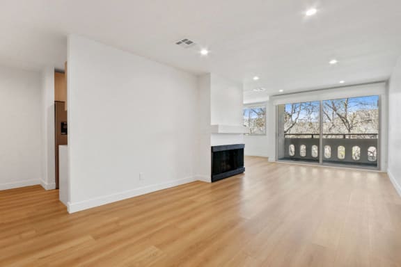 Floor Plan  a living room with a fireplace and a large window