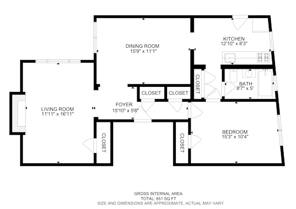 Floor Plan  A floor plan of a house with a living room, dining room, kitchen, and bedroom.
