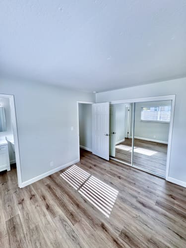 Floor Plan  a living room with a hard wood floor and a sliding glass door