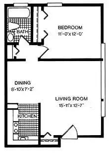 Floor Plan  A floor plan of a small apartment with a bedroom, living room, and kitchen.