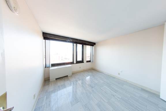 Floor Plan  A room with a window and a radiator on the wall.
