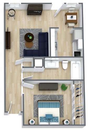 Floor Plan  A top-down view of a small apartment with a kitchen, living room, and bedroom.