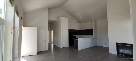 Floor Plan  an empty room with white walls and a fireplace