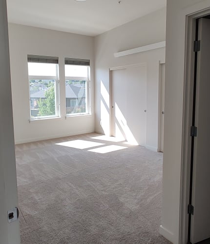 Floor Plan  a bedroom with two windows and a door