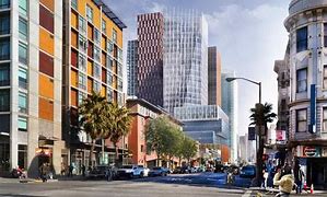 A city street with cars and buildings.